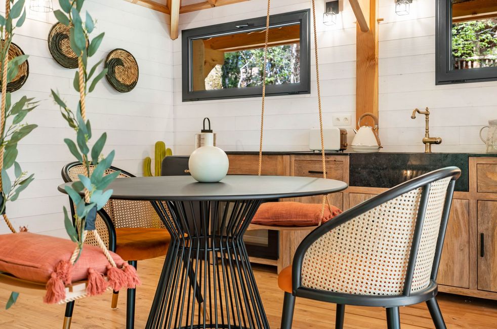 Interior of Kali Lodge with the kitchen area, table and two chairs