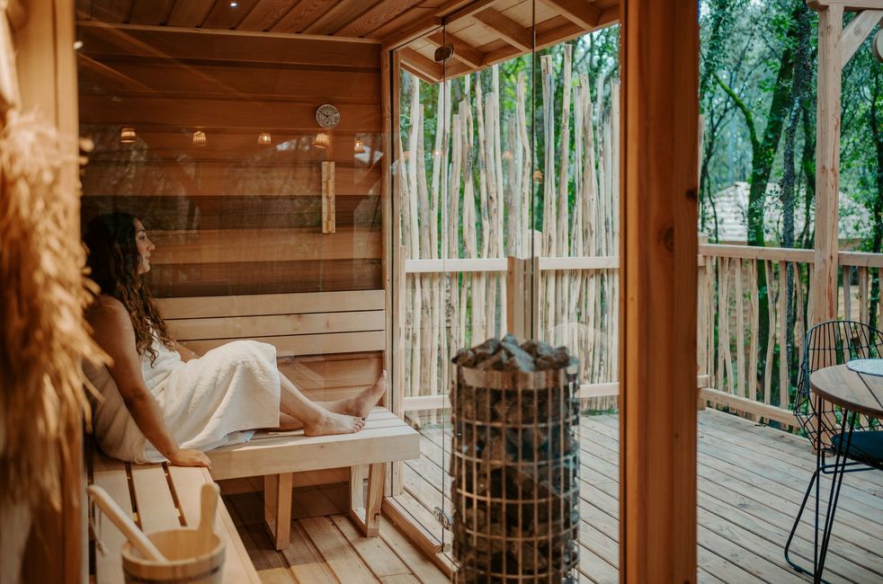 Woman in a sauna of a lodge in Calviac